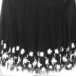 Black skirt with embroidered white flowers